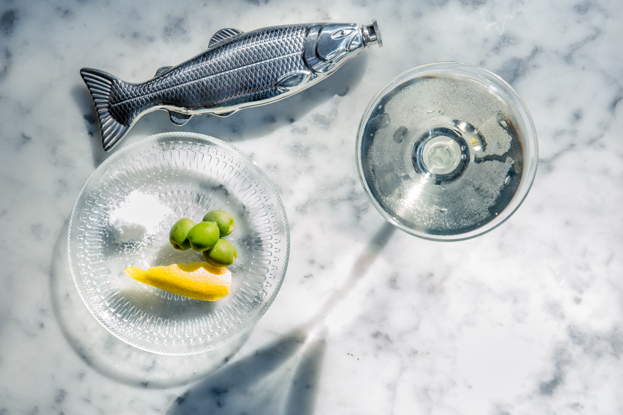 Martini served in a fish flask cocktail