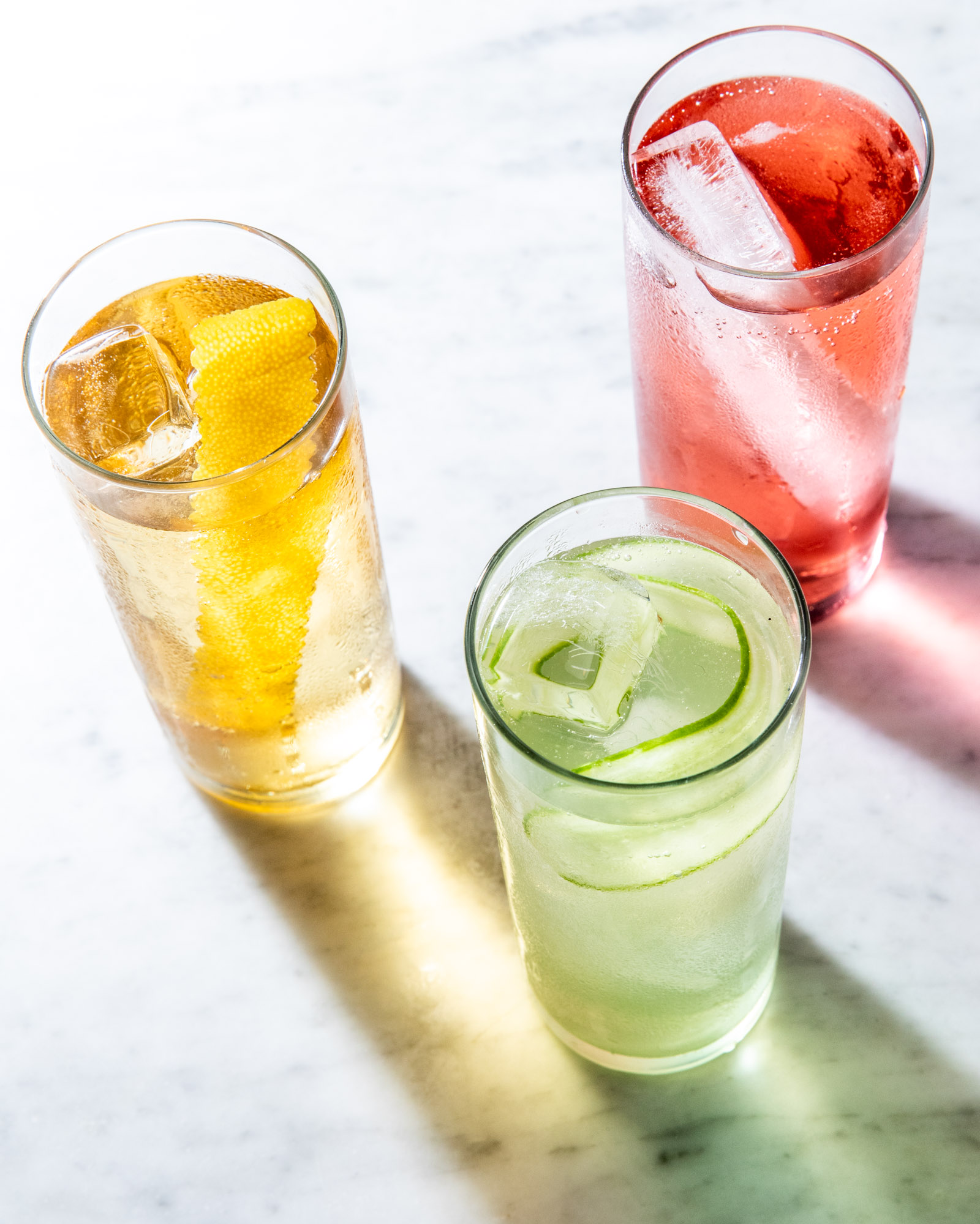 a trio of colorful cocktails